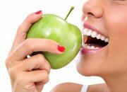 Woman eating apple, GI diet